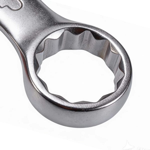 Macro shot of the 12-point box end (ring end) of a WOKIN combination spanner, highlighting the inner profile for secure fastening.