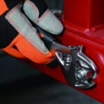 Side view of a WOKIN stubby adjustable wrench being used for industrial repair work.