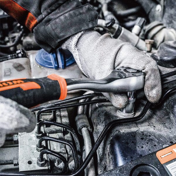 Using a ratchet and socket from the Wokin 98pcs tool chest set on an engine
