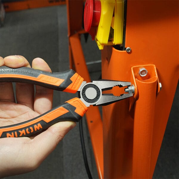 Using combination pliers from the Wokin 98pcs tool chest set to grip a nut