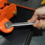 Using a combination wrench from the Wokin 163pcs roller cabinet tools set on a bolt and nut