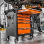 Using the Wokin 163pcs roller cabinet tools set for automotive repair in a garage