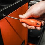 Using a Phillips screwdriver from the Wokin 4Pcs Screwdrivers Set on orange equipment