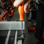 Using a screwdriver from the Wokin 4Pcs Screwdrivers Set to tighten a screw