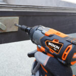 Using Wokin 20V Li-ion Brushless Cordless Impact Wrench with bit to fasten screw in metal