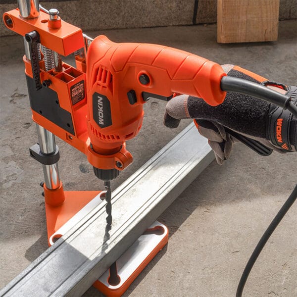 Wokin Drill Stand in use with a Wokin electric drill, drilling into metal channel