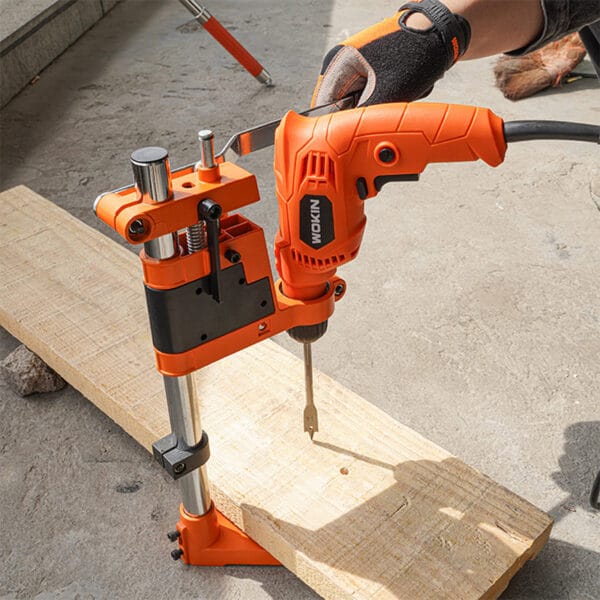 Wokin Drill Stand with attached Wokin electric drill being used on a wooden board