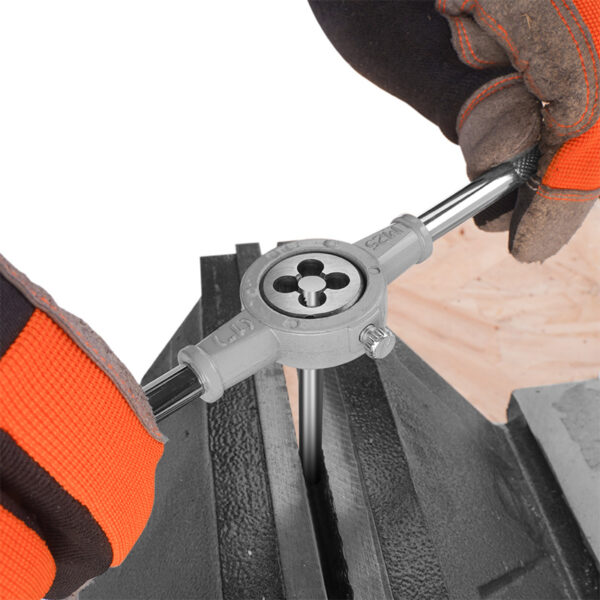 Close-up of Wokin die and die stock from 8pcs set being used for thread cutting
