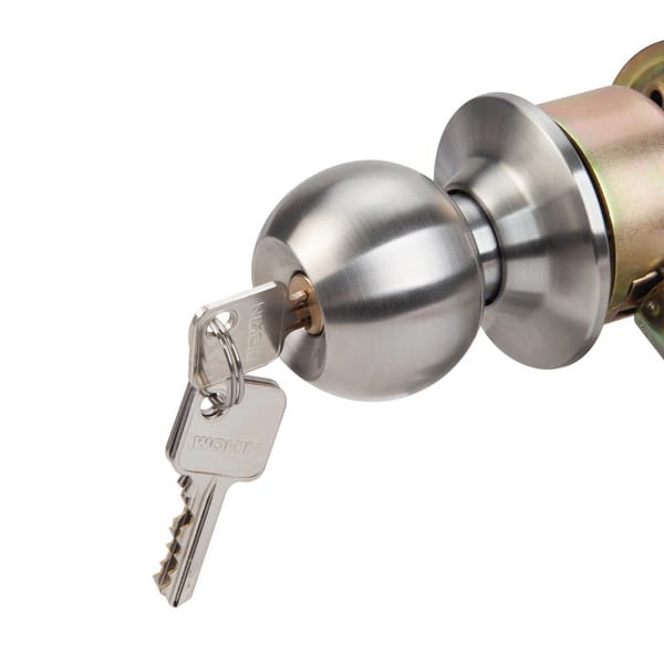 Close-up of WOKIN cylinder-type spherical door lock with key inserted into metal knob