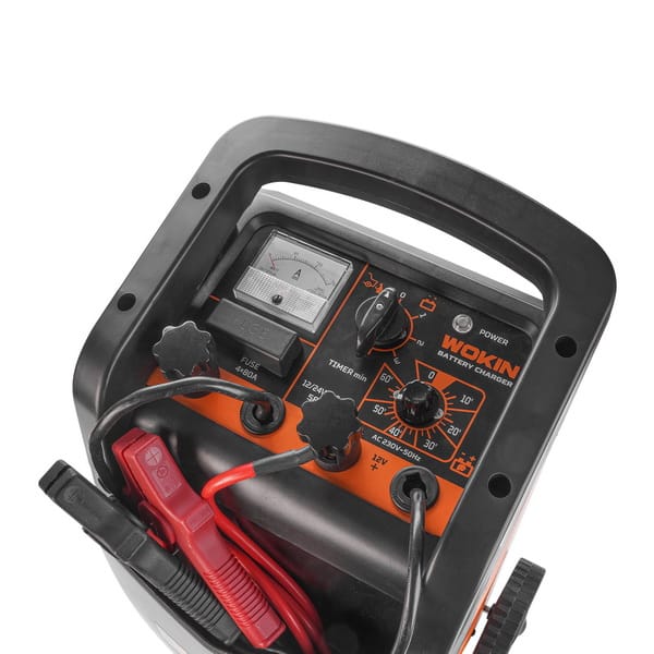 Control panel of WOKIN battery charger featuring an analog ammeter, 60-minute timer, fuse access, and switches for 12V/24V selection and boost mode.