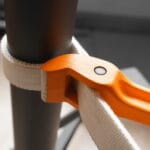 WOKIN strap wrench in use securely gripping a smooth pipe, illustrating its non-marring application ideal for plumbing and polished surfaces.