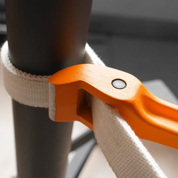 WOKIN strap wrench in use securely gripping a smooth pipe, illustrating its non-marring application ideal for plumbing and polished surfaces.