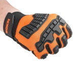 A person wearing the WOKIN anti-impact mechanic glove with a clenched fist, demonstrating how the EVA rubber armor protects the hand during heavy labor.